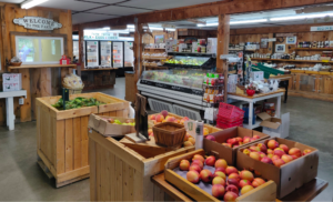 Farm store with fresh fruits and vegetables for sale.